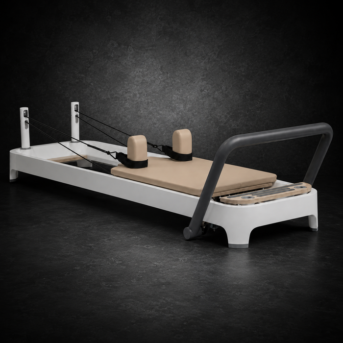 Holtmark Fixed Track Pilates Reformer on dark studio background